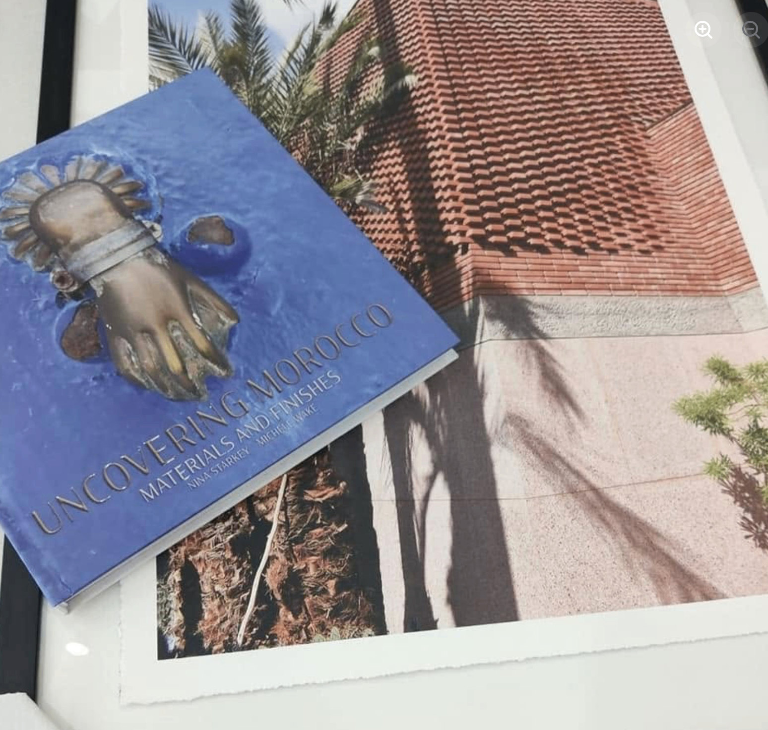 Uncovering Morocco book styled with a framed Marrakesh print