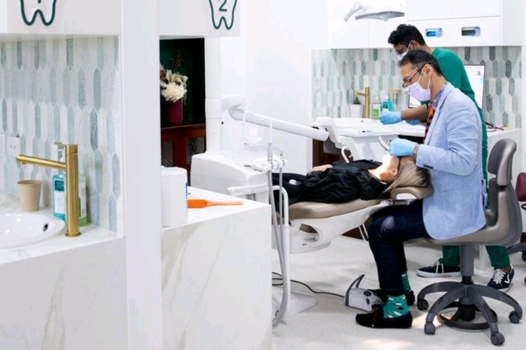 Wired Orthodontics treatment bay with brand tiles and monogram wayfinding
