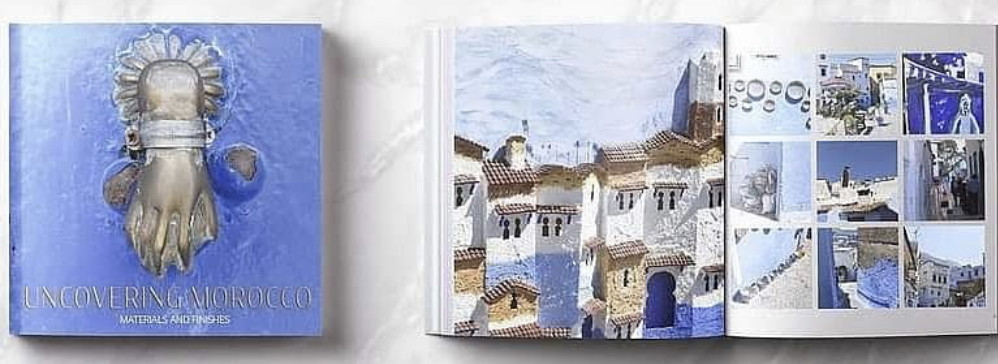 Uncovering Morocco book open to a spread of Chefchaouen photography