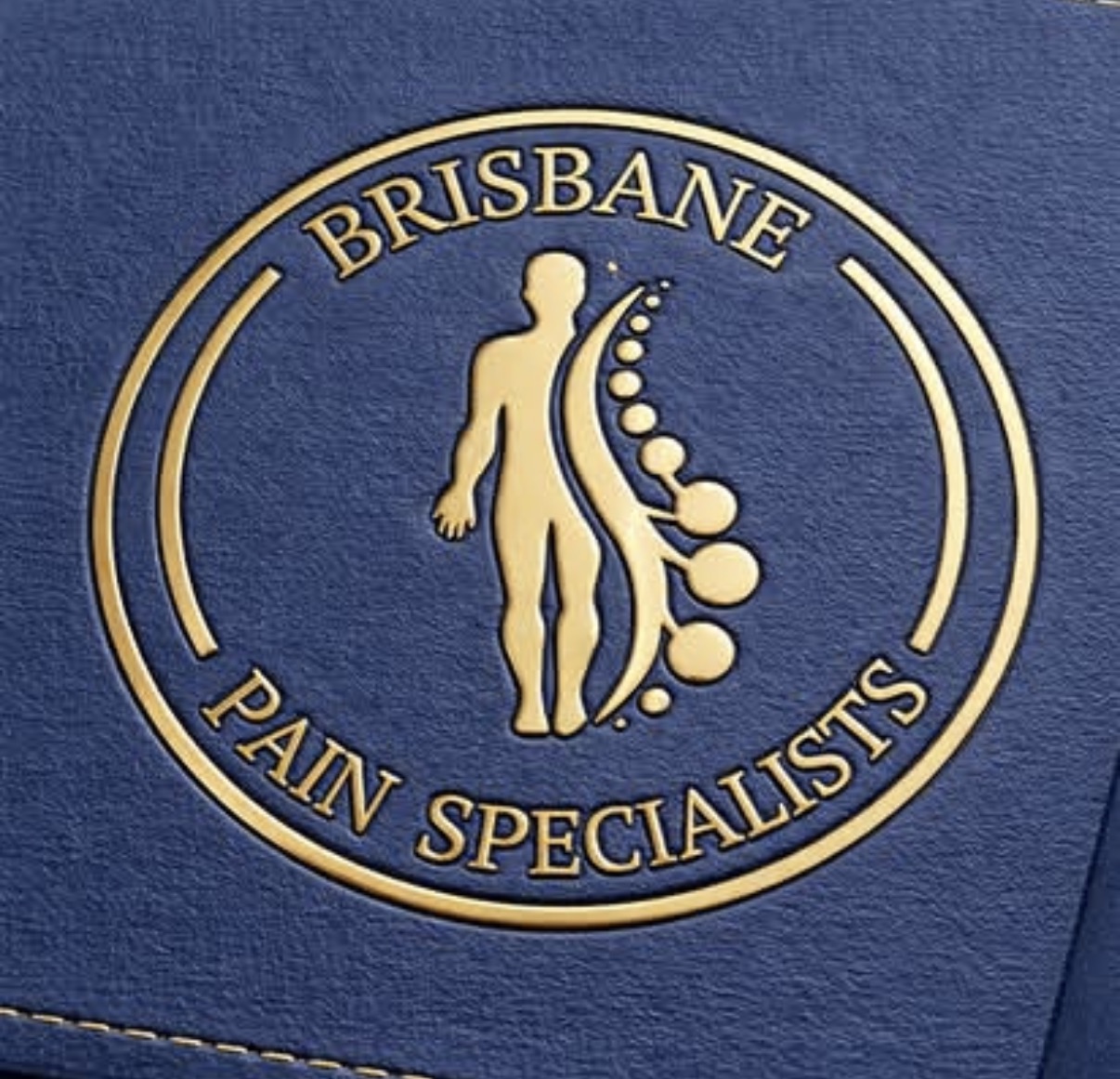 Close-up of the gold embossed Brisbane Pain Specialists figure emblem